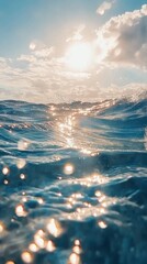 Golden sunlight reflected on sparkling ocean waves. Sparkling ocean waves reflecting golden sunlight. Vertical