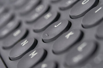 Close up view of a black computer keyboard with focus on letter keys and elegant design.