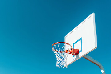 Basketball Hoop against a Clear Blue Sky