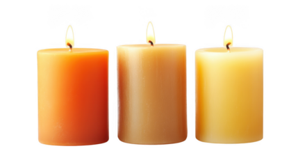 Three lit candles in shades of orange and yellow standing in a row on a dark background