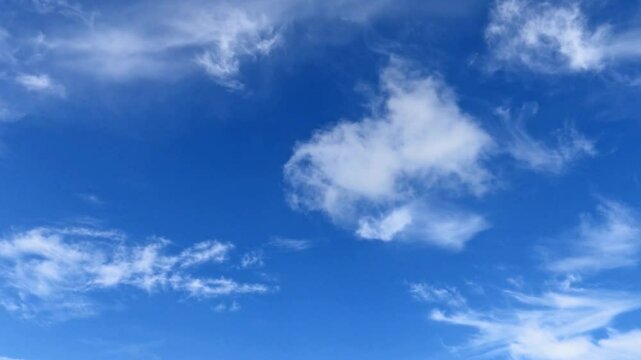 Beautiful sunny clear dark blue sky with white fluffy cloud n cumulus cloudscape in tropical summer sunlight n sun ray at daylight sunshine day, Nature 4k TimeLapse stop motion background   