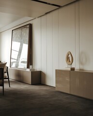 Minimalist home interior design of modern living room. Stylish cabinet near white wall with stone decorative sculpture and big art work in frame.