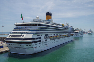 Modern family cruiseship Pacifica and other cruise ship liners in port of Barcelona, Spain on sunny...