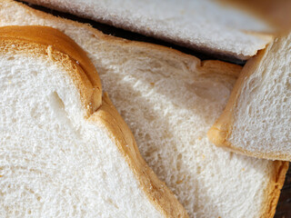 Close-up of freshly sliced ​​soft and fragrant bread with white bread,brown bread crust macro