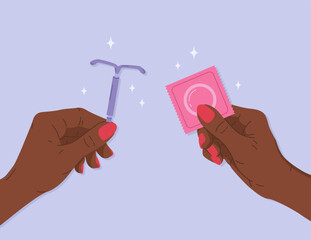 Female hands holding intrauterine device and condom package. Concept of contraception methods for women and men, protection against infections and unwanted pregnancy. Birth control, safe sex concept