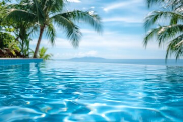 Fototapeta premium Calm Waters of a Tropical Infinity Pool Under a Clear Blue Sky by the Ocean