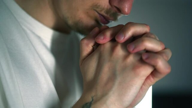 Portrait of a man who prays to God and reads a prayer.
Faith in higher powers.
A religious person turns to God for help.
God, church, religion, saint, help