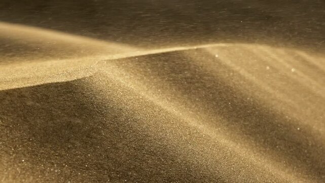 Grains of sand waving in the wind during sandstorm. Slow motion shot of golden sand blowing over dunes in wind. Dune desert sands during sandstorm 
