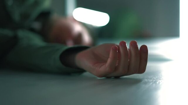 Man dead and lying on the floor.
Heart attack in a man.
Man fell on the floor due to illness and heart attack
