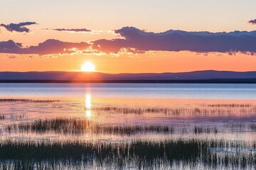 Obraz premium Sunset over a tranquil lake
