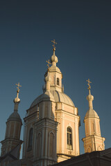 Golden domes of the temple in the rays of the evening sun