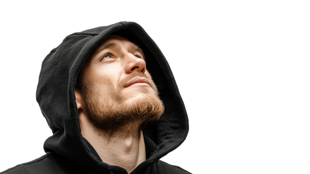 A young man in a black hoodie looking up with a thoughtful expression. Transparent background, PNG file.