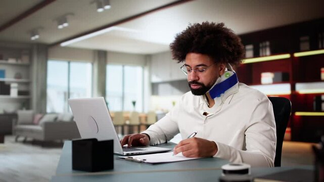 Young African American Man At Home Typing