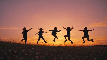 A group of people leaping and jumping together in unison, conveying joy and excitement