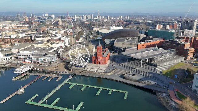 Orbiting aerial shot of Cardiff Bay with The Senedd, Welsh Government buildings