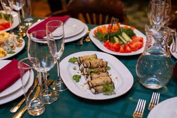 eggplant rolls on a served table