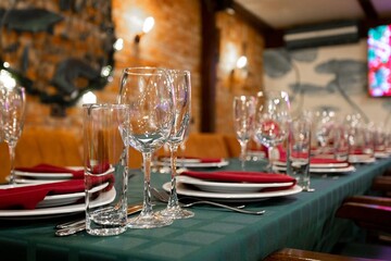 set table with cutlery and glasses