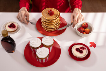 Canada Day traditional food concept. A girl in a classy cafe eats in Canada. Breakfast and lunch.