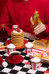 Canada Day traditional food concept. A girl in a classy cafe eats in Canada. Breakfast and lunch.