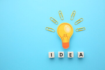 Creative thinking ideas and innovation concept. Paper scrap ball yellow colour with light bulb...