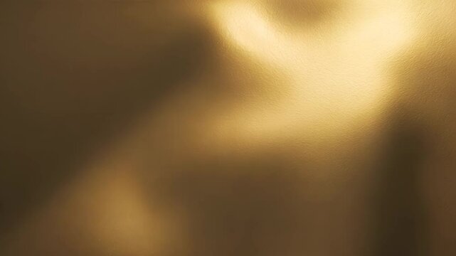 Gold texture or background with gradients and shadow effects.