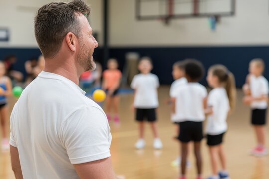A physical education teacher leading a group of energetic students during a gym class, highlighting the importance of sports and teamwork in building skills and friendships.