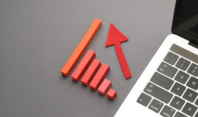 Colorful bar graph with arrow pointing upwards. Business, market growth and progress concept.