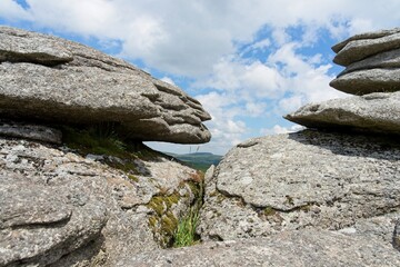Eroded pancake rock at Bellever Tor in Dartmoor National Park in Devon England