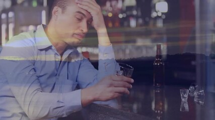 Holding drink at bar, pensive man with sunset animation in background