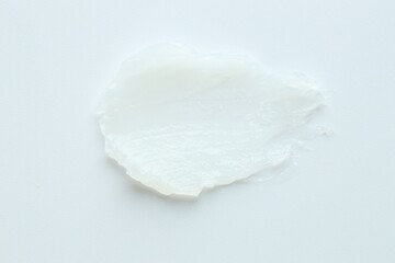 Moisturizing lip balm on white background, top view