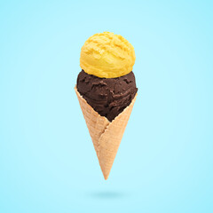 Yummy ice cream served in waffle cone in air on light blue background