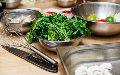 Fresh Cilantro and Kitchen Tools on Counter.