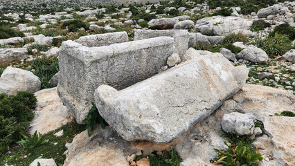 A Roman-era stone sarcophagus located within the ancient ruins of Sakizlik, in the Saglikli neighborhood of Tarsus, Mersin.