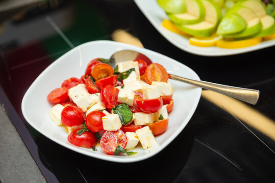 Caprese salad with cherry tomatoes and mozzarella.