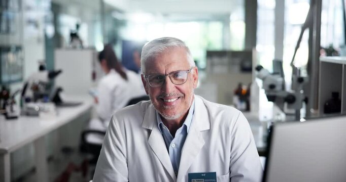 Scientist, man and smile on face, computer or review process for results, pharmaceutical or medical research. Person, portrait and excited for clinical trial with pride, happy report for study at lab