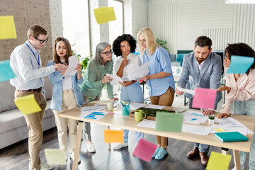 Diverse group of colleagues collaborating on a project in a bright modern office workspace