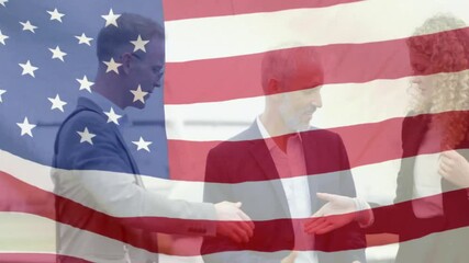 Shaking hands, business people with American flag animation overlay in background - Powered by Adobe