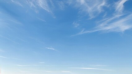 Light Blue Vault of Heaven, Filmy Clouds Wandering. The light blue sky is pure and vast. A few filmy clouds float leisurely, as if dancing gently, adding a touch of leisure and agility to the boundles