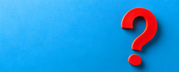 Photo of a question mark on a blue background, symbolizing the unknown and searching for an answer