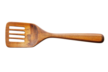 A wooden spatula rests elegantly on a white background, highlighting its grain and design