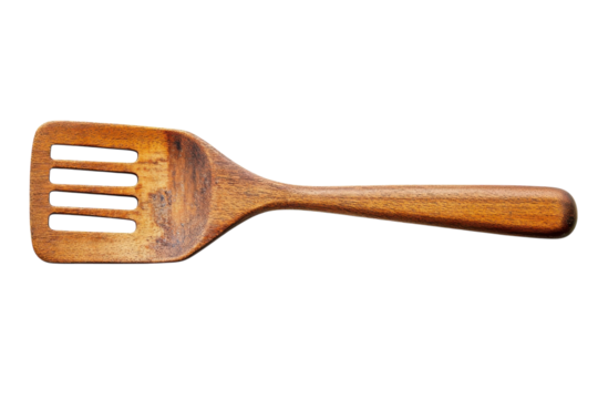 A wooden spatula rests elegantly on a white background, highlighting its grain and design