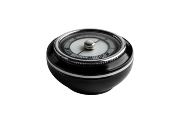 Elegant vintage black compass resting on a minimalist surface with soft lighting for artistic effect