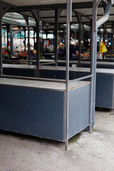 Empty market stalls in a bustling urban area