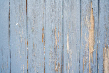 Obraz premium A wooden surface with a blue hue and a lot of peeling paint