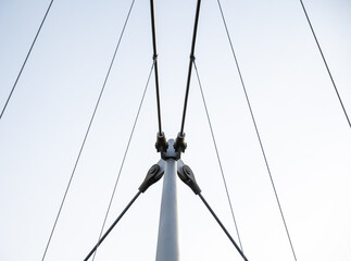 A tall metal structure with many wires and cables