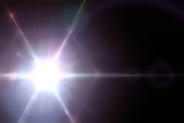 Bright light shining on a dark background with lens flare effect