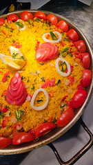 Saffron rice with shrimp and tomatoes served at hotel restaurant