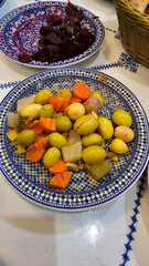 Pickled gherkins, onion, chilli and various types of olives in a bowl