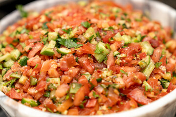 Fresh Homemade Salsa Salad with Tomatoes, Cucumbers, and Parsley. Traditional Mediterranean and Middle Eastern Healthy Appetizer, Perfect for Vegan, Vegetarian, and Low Calorie Diets, Organic Food 