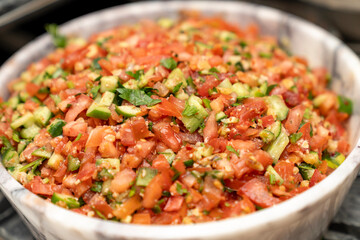 Fresh Homemade Salsa Salad with Tomatoes, Cucumbers, and Parsley. Traditional Mediterranean and Middle Eastern Healthy Appetizer, Perfect for Vegan, Vegetarian, and Low Calorie Diets, Organic Food 